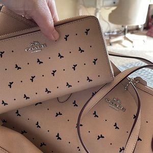 Coach tan large tote with butterfly or bow cutout